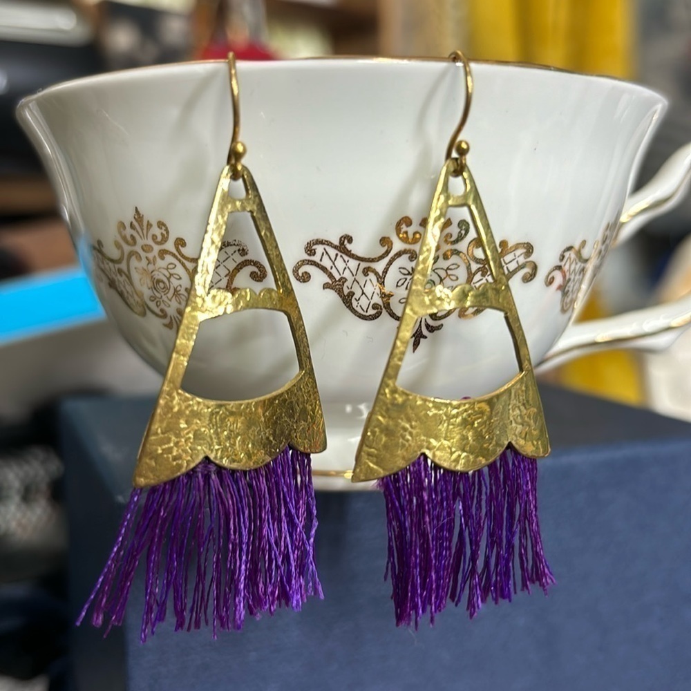 Gold metal and purple string dangle earrings